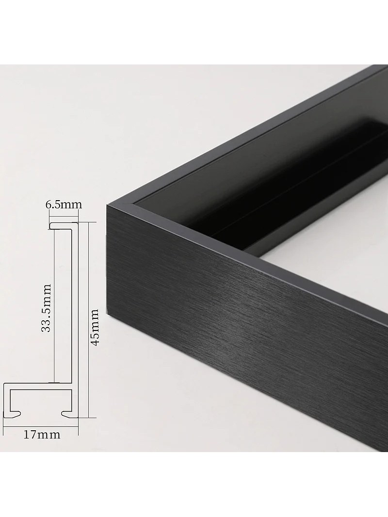 Black aluminum picture frame corner with a dimensioned profile cross section