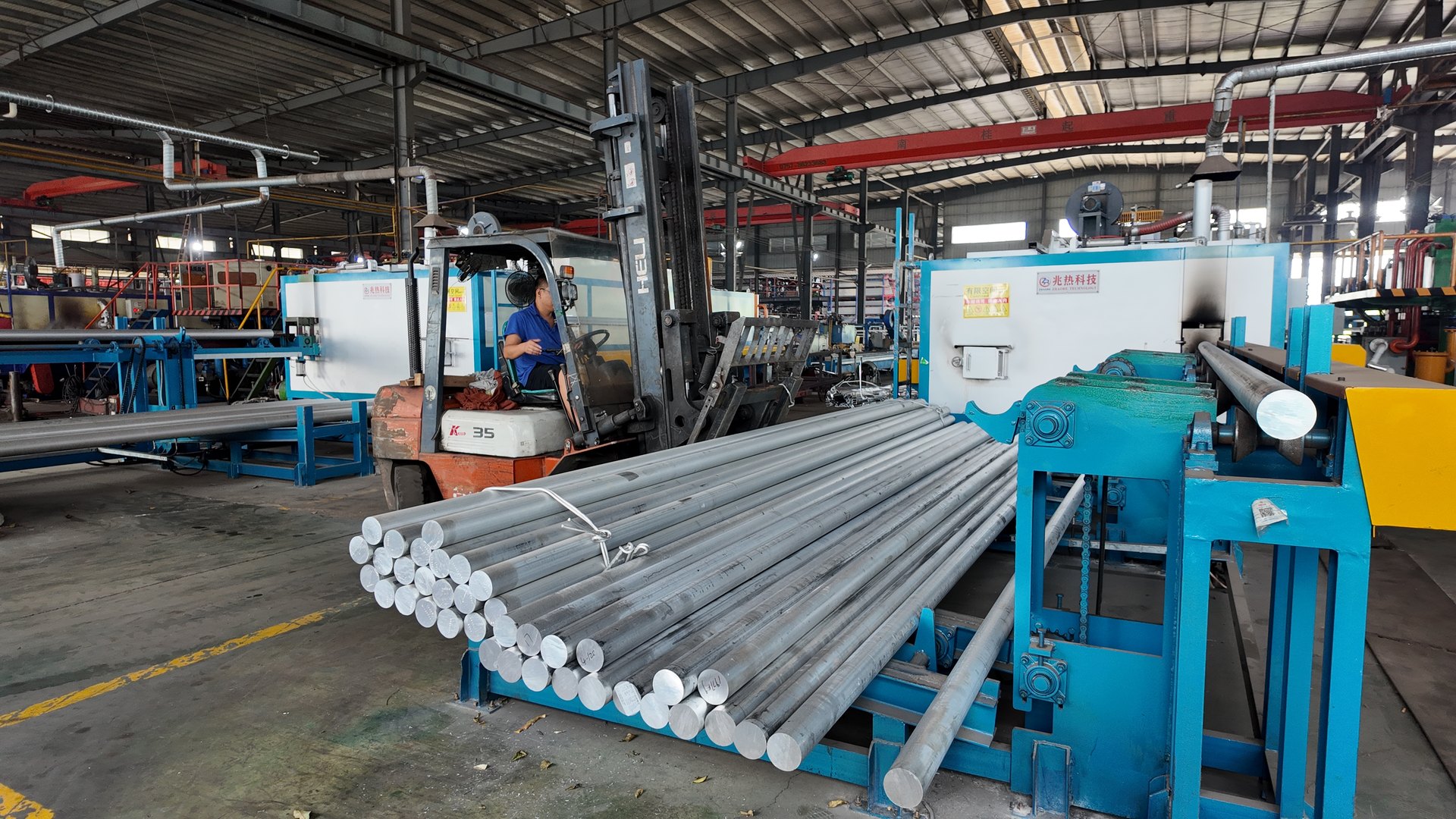 Round aluminum stock and material handling equipment in the factory